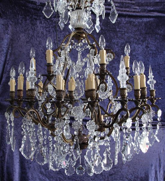 An 18th century style bronzed metal and cut glass thirty light chandelier, by Christopher Wray, drop 4ft